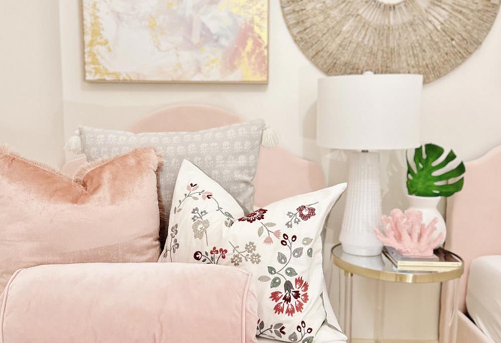 Living room with blush sofa and coastal styling at Casa Cova, South Padre Island